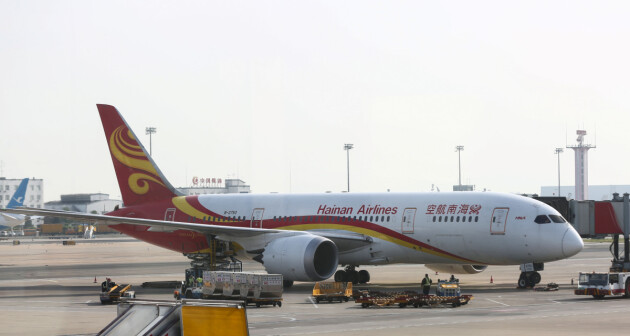 A Hainan Airlines Boeing 787-8 Dreamliner aircraft sits on the tarmac at the airport in Beijing, China May 13, 2018. Picture taken May 13, 2018. REUTERS/Stringer ATTENTION EDITORS - THIS IMAGE WAS PROVIDED BY A THIRD PARTY. CHINA OUT.